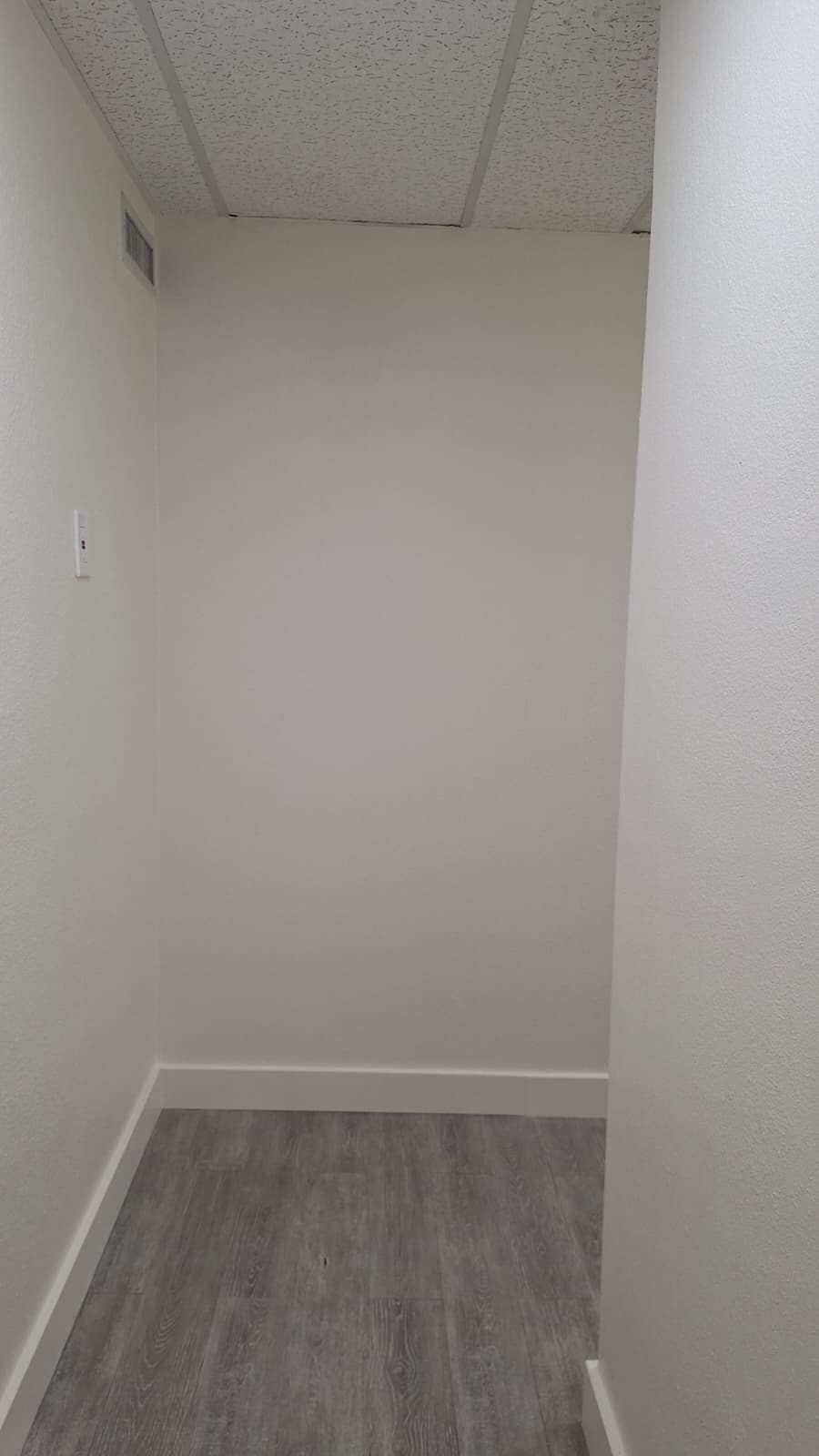 Completed white wall closing off the office view